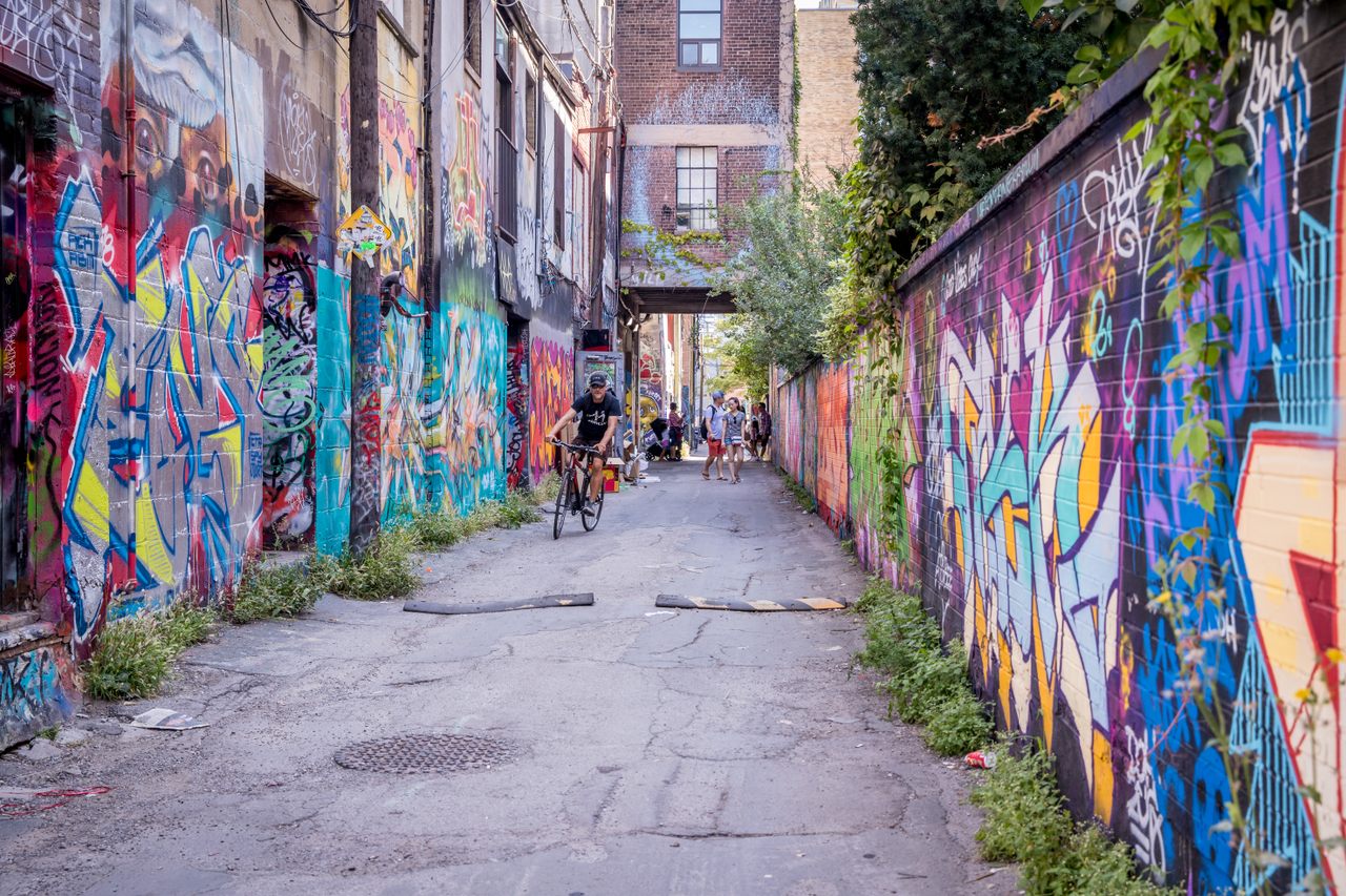 While initially unsanctioned, Toronto’s graffiti community converted this largely ignored alleyway into an epicenter of world-class street art.