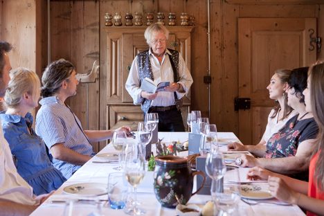 Guests enjoy a Bénichon meal at an event photographed by the region's tourism board.