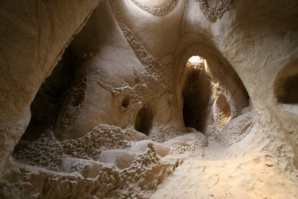 For over 25 years, New  Mexico artist Ra Paulette has been creating natural crevasses in the New Mexico wilderness and painstakingly chiseling, diggin