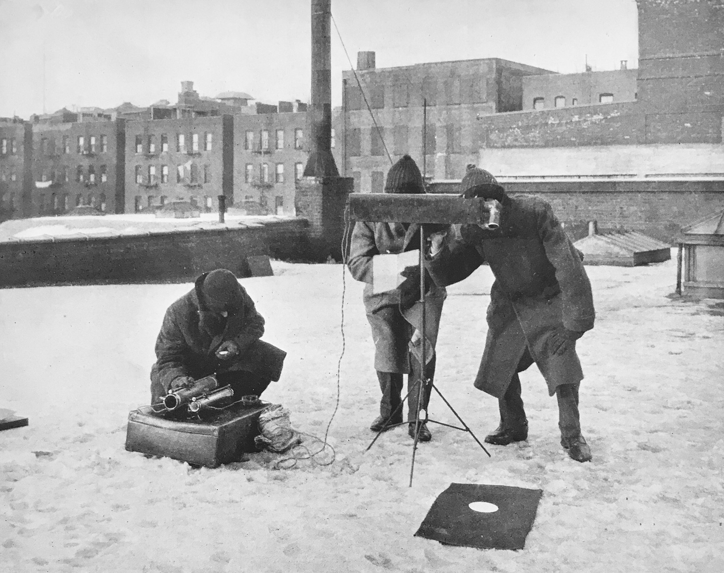 New York Edison Company employees measure the intensity of light during the 1925 solar eclipse in New York City.