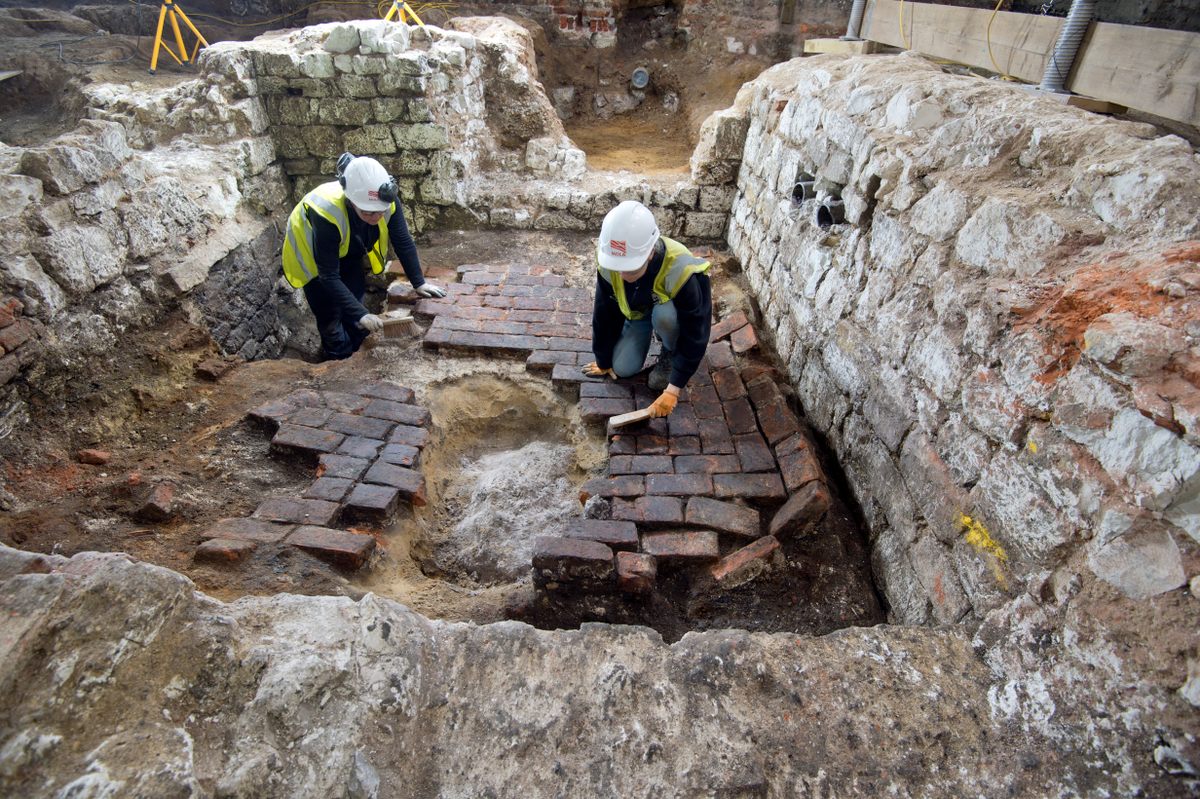 The pit had been backfilled and covered with layers of bricks before it was built over centuries ago.