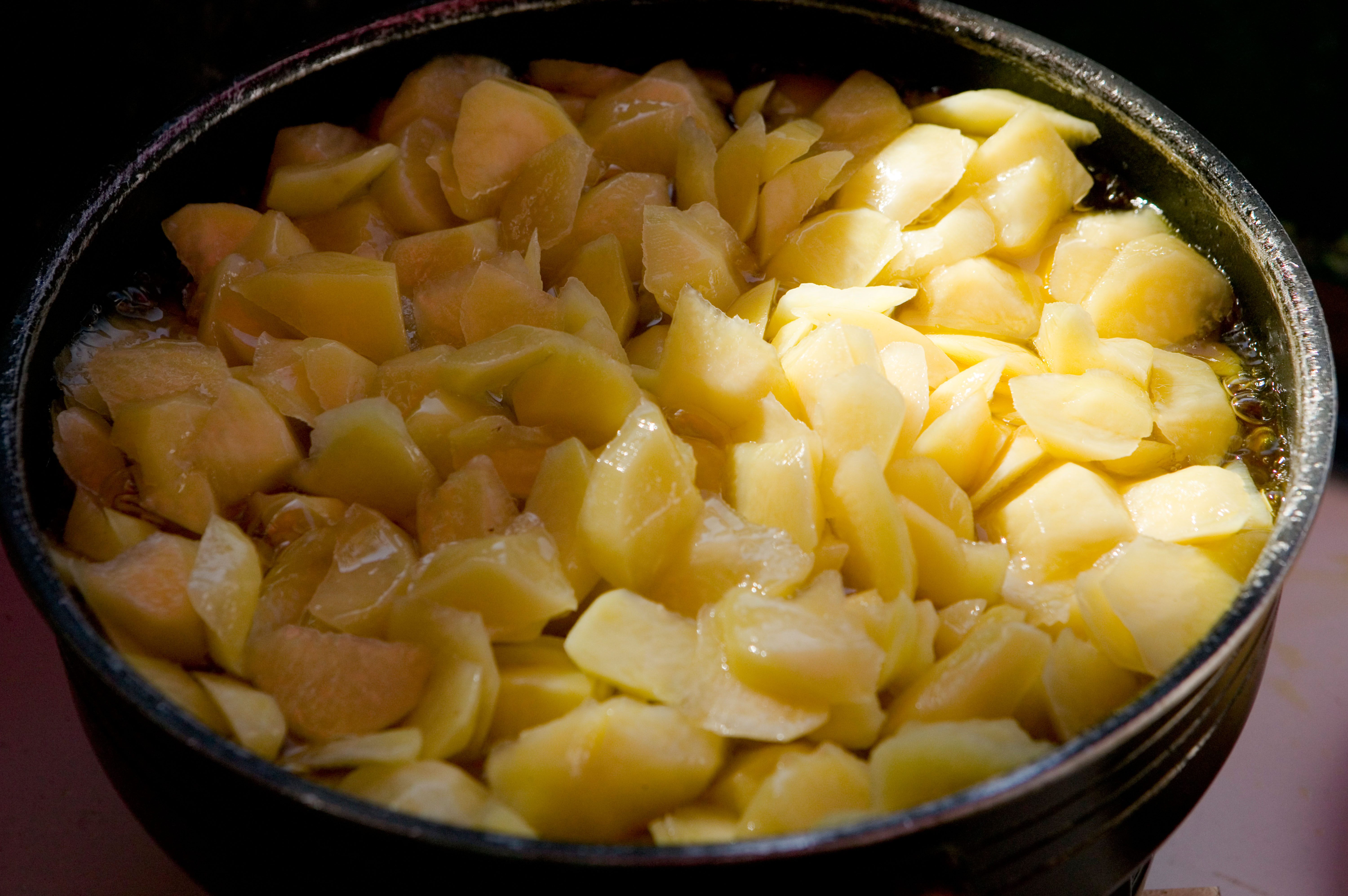 Potatoes cooking in oil to make a tortilla. 