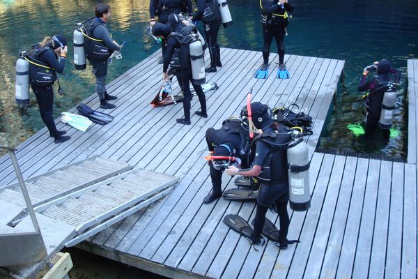 Divers gear up for an aquatic adventure at the Blue Grotto.