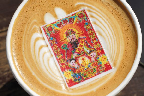 This latte, from the People's Cafe, comes with an edible picture of the God of Wealth on top.