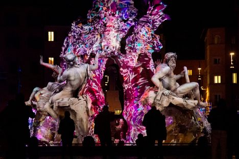 The Fountain of the Four Rivers (Fontana dei Quattro Fiumi) in Rome's Piazza Navona is decorated with a light-mapping display. 