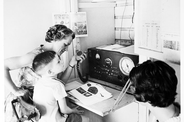 A School of the Air primary student in regional Queensland takes class via two way radio, c. 1960