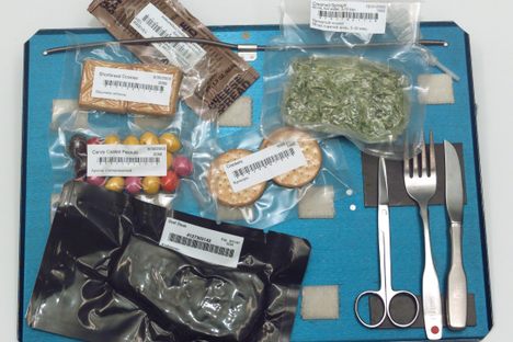 American astronauts might eat steak with creamed spinach, and snack on crackers and candy-coated peanuts.