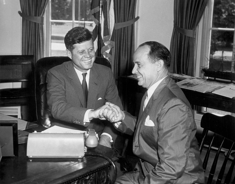 John F. Kennedy and Chep Morrison share a slightly awkward handshake in 1961.