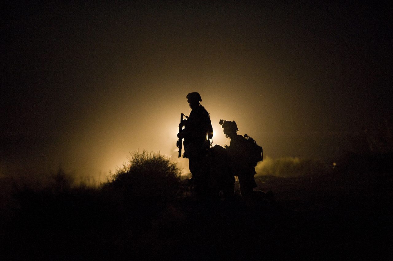 U.S. Marines stand guard in the Garmsir district of Helmand Province in 2009. The province was the site of the most deaths of American and British soldiers during the U.S./NATO–led occupation of the country. 