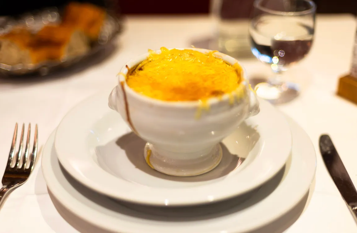 The soup is topped off with a thick layer of melted Gruyère cheese.