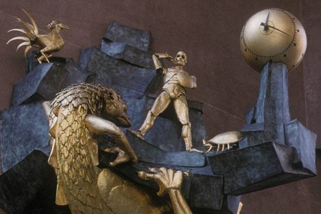 Le Défenseur du temps—The Defender of Time—has been reinstalled in the Quartier de l'Horloge in Paris. Throughout the day, the metal swordsman marks the passage of time by fighting off a dragon, a rooster, and a crab.
