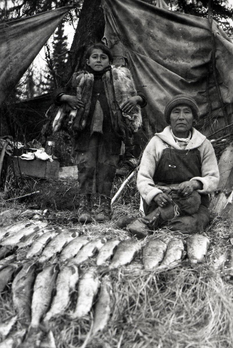 Katie Trefon and her mother, Mary Ann Trefor, at the mouth of Walker's Slough, circa 1927. The photo demonstrates the land's abundance under Dena’ina care.