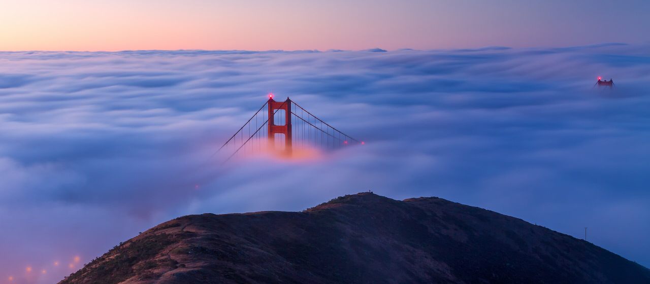 The Golden Gate Bridge as seen from the Marin Headlands at sunrise.