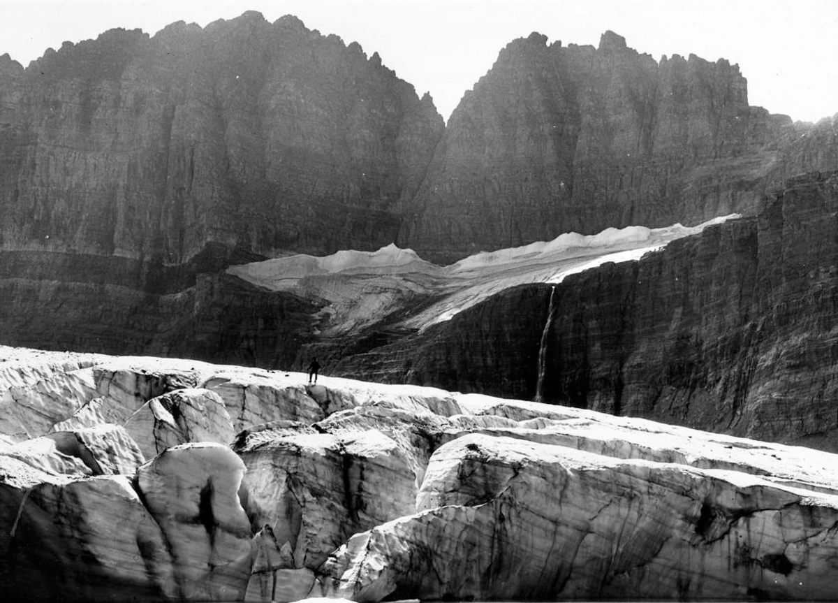 It's easy to miss the figure standing atop Grinnell Glacier in this 1938 photograph.