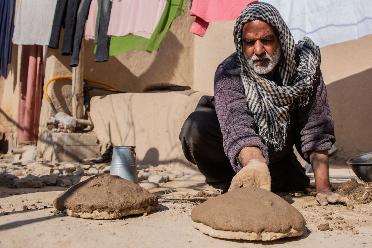 Ziaulhaq Ahmadi makes bowls of mud and straw for fresh grapes. 