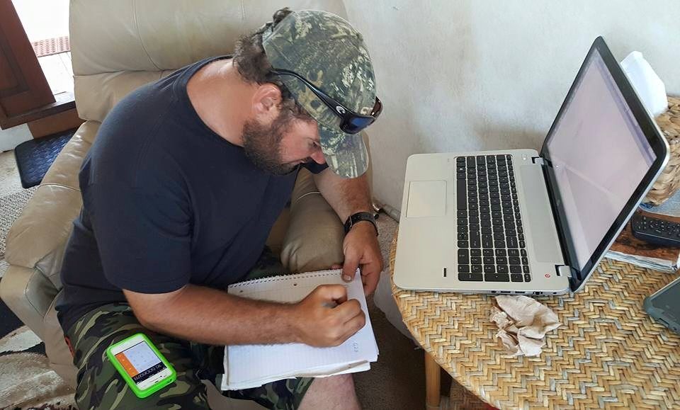 Eric studying charts and maps of the wreck site