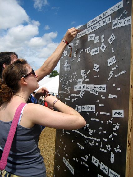 Happy customers at a communal magnetic poetry wall in Suffolk, England.