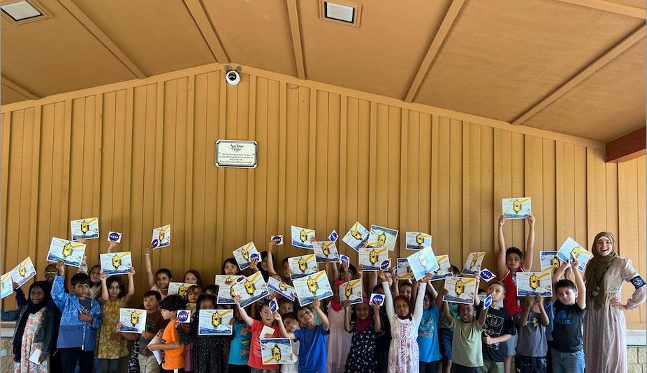 In August 2023, children at an Islamic summer camp held up pictures of NASA’s James Webb Telescope after a presentation about the telescope.