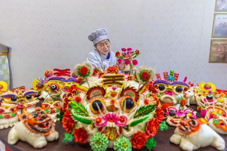 Steamed bread in the shape of tigers is displayed at a stall ahead of the Lunar New Year in Yuncheng, Shanxi Province, China.  (January 16, 2022) 