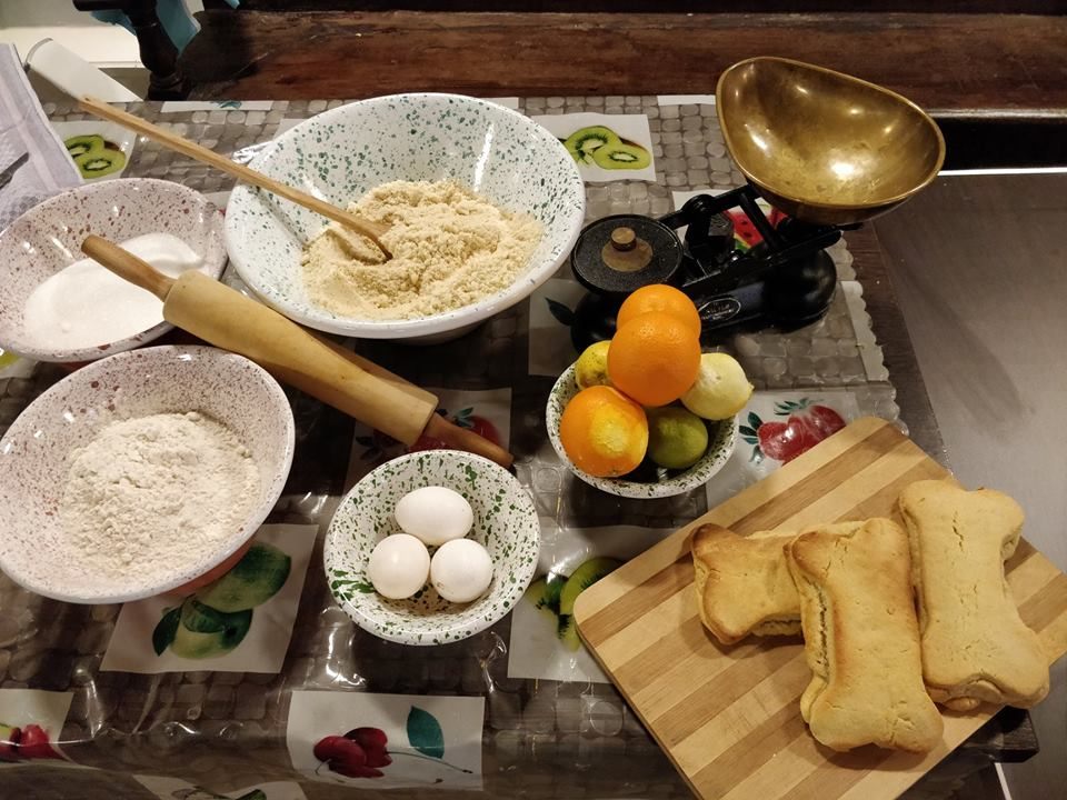 The ingredients for <em>għadam tal-mejtin</em> being displayed at a Malta Heritage sponsored event, where the cookies are being made as part of an educational program for students.