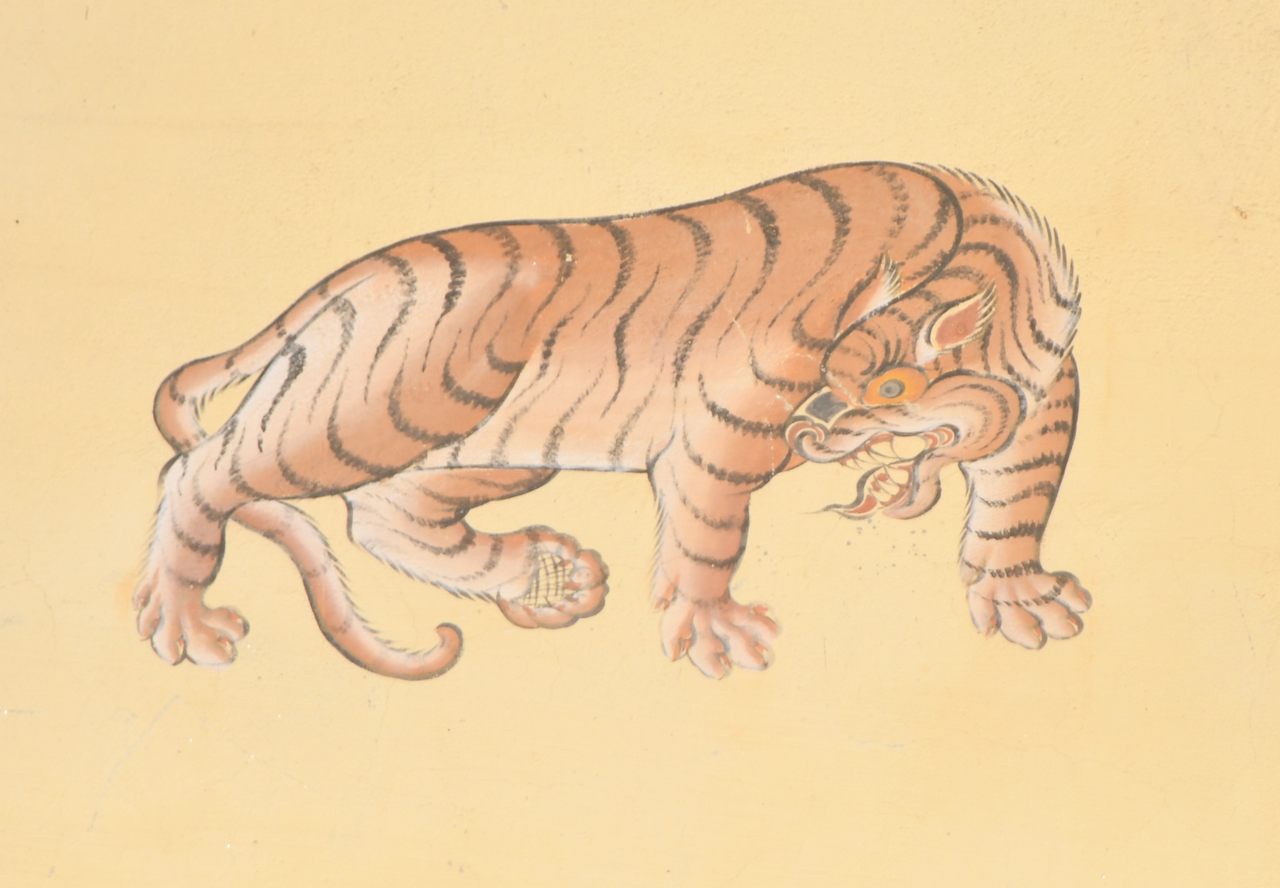 A tiger painted on a building in Thimphu; tigers are particularly revered in Bhutan.