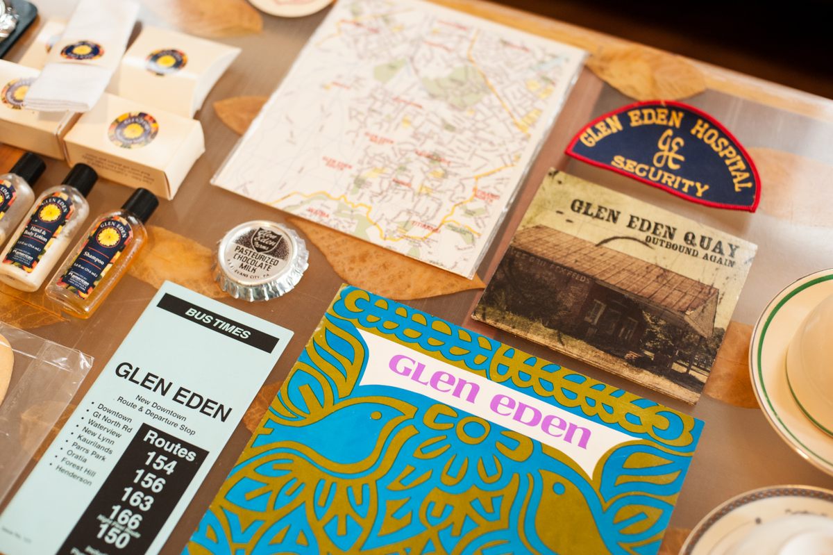 A selection of items from the collection, including a bus route, hotel soaps, and a CD.