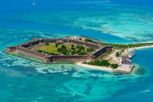 The Fort Jefferson naval station is a centerpiece of Dry Tortugas National Park. The crystal clear waters surrounding it are a top destination for seeing colorful sea life while snorkeling and diving. 