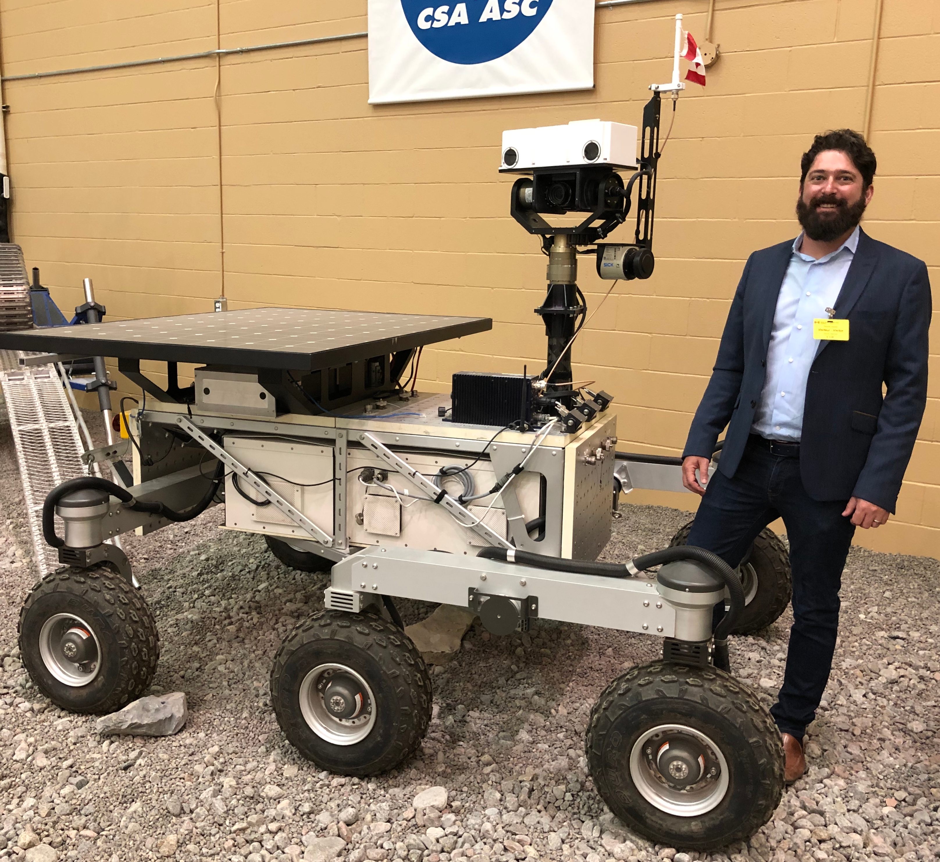Christopher Hamilton with the RAVEN rover.