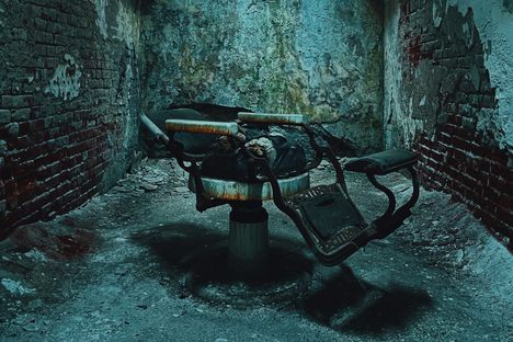 Our first place winner is Drew Babineau's photograph of a barber chair inside of a cell at Eastern State Penitentiary in Philadelphia, Pennsylvania. 