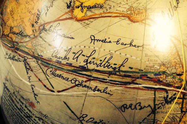 Charles Lindbergh and Amelia Earhart’s signatures and route lines.