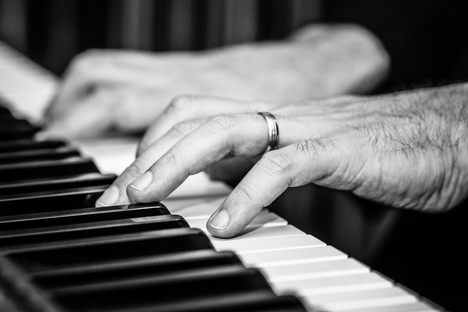 A German pianist playing a classical tune. 