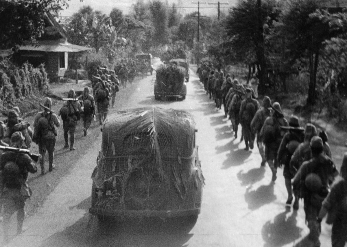 Japanese troops march toward Manila in late December 1941. They would occupy the city for more than three years.