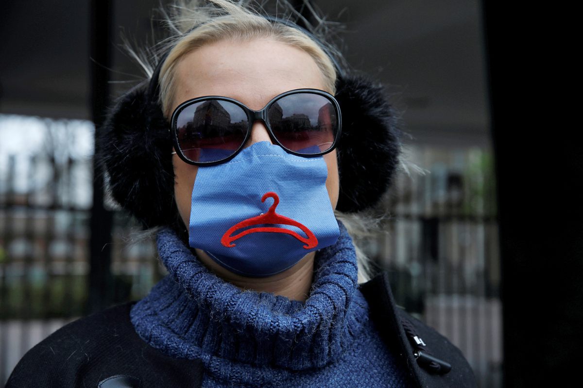 An activist in Poland wears a protective mask to protest the tightening of Warsaw's abortion rules, April 15, 2020.