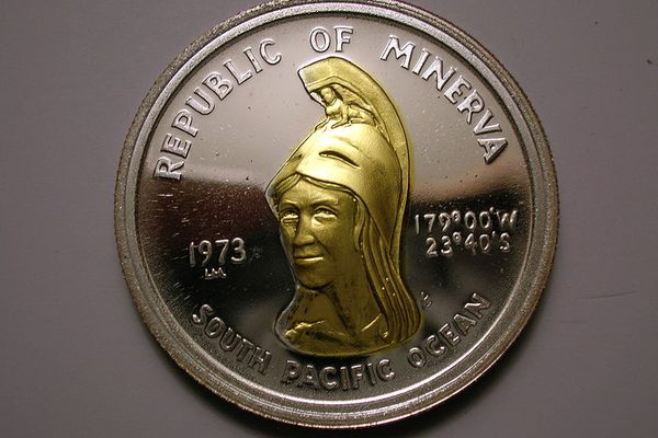 The obverse of the 35 Minerva Dollar coin - 1973