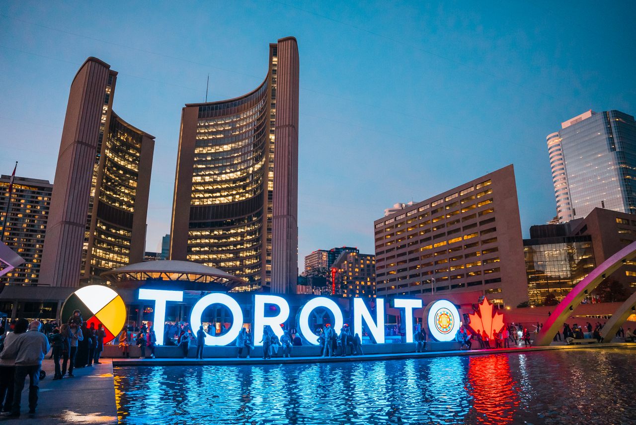 The glowing lights of the Toronto Sign, an illuminated three-dimensional monument in Nathan Phillips Square