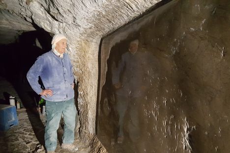 Daniel Monnier in 2019, reflected in his polished limestone mirror. 