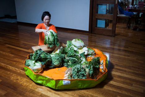 Photographer Sangsuk Sylvia Kang's mother Kyung Ae Lee performs kimjang, the practice of making kimchi, at her home in South Korea. 