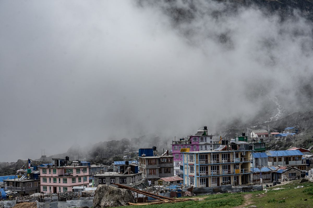 Kyanjin Gompa sinks into the mist.