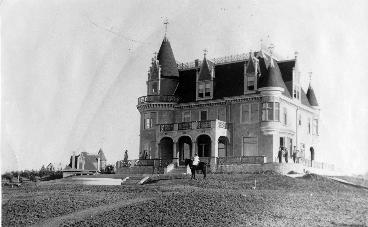 Cornelia Hill in front of her home, c. 1897-1905, before it was sold to J. Alfred Kimberly. 