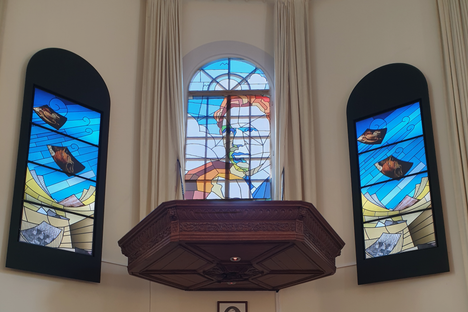 Inside the church still stands the pulpit once occupied by Vincent's father. Now, it stands underneath a stained glass window displaying Vincent as a young boy and man.