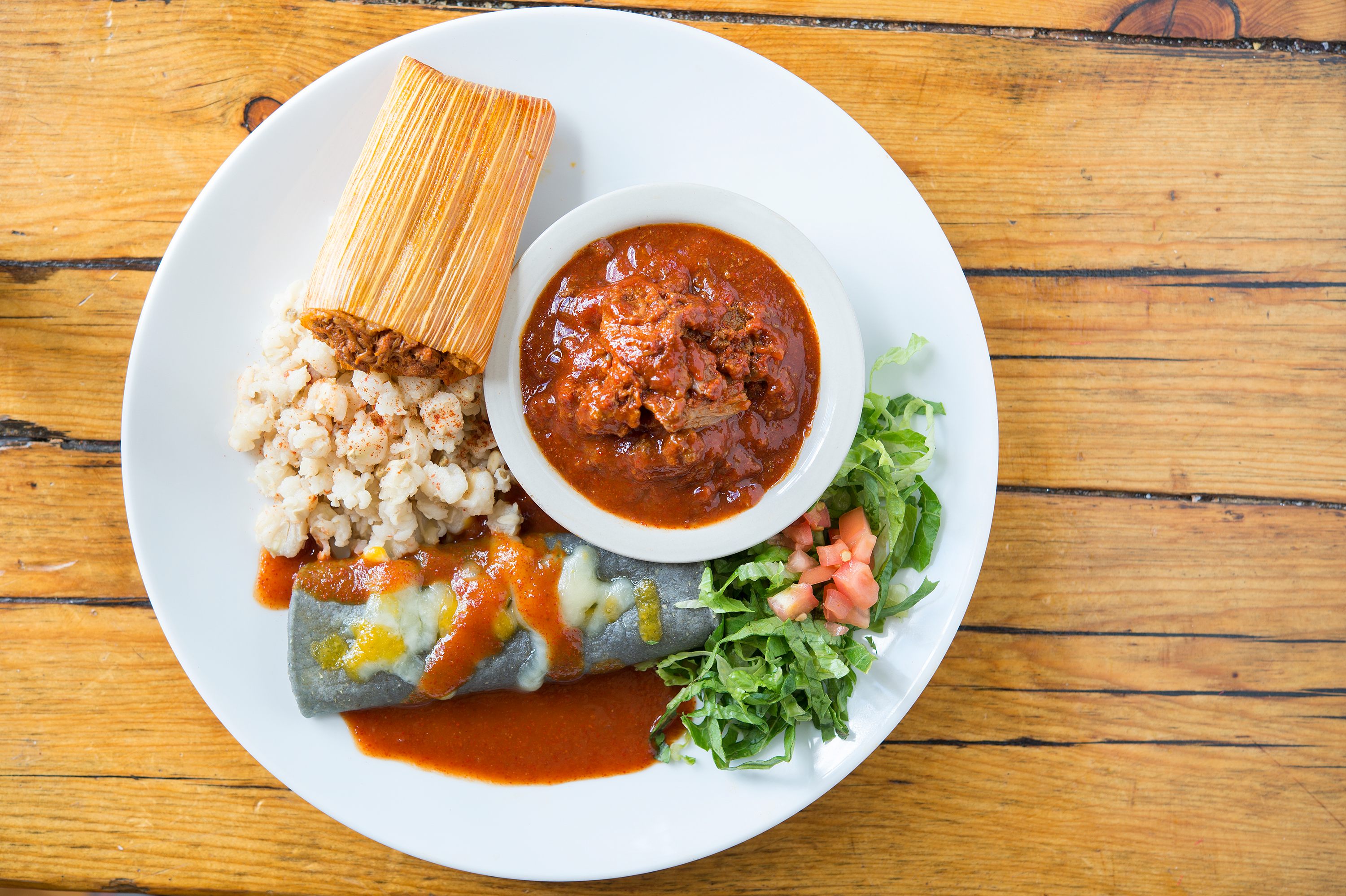 Rancho de Chimayó's combination plate features their specialty: carne adovada, made with red chimayo chile when it's available.