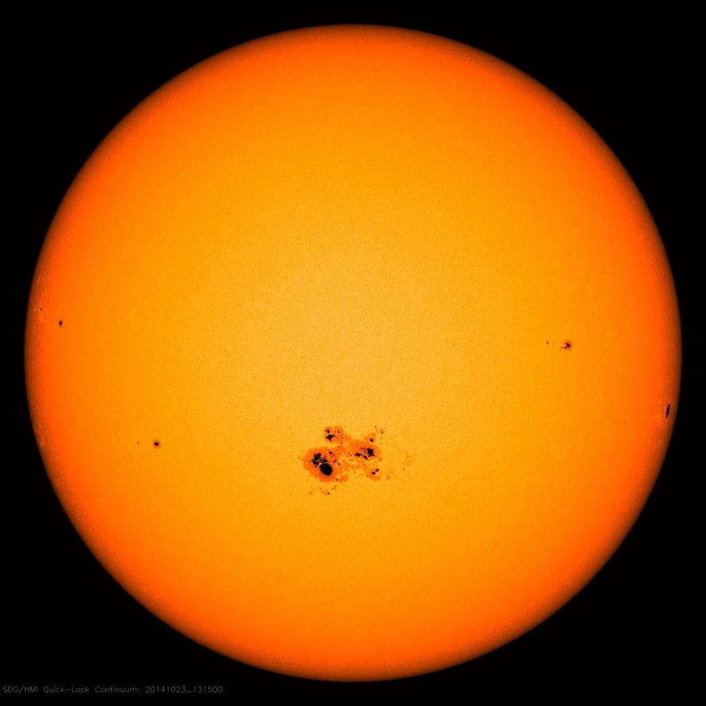 The sunspot on this 2014 image is larger than the diameter of ten planets the size of Earth.