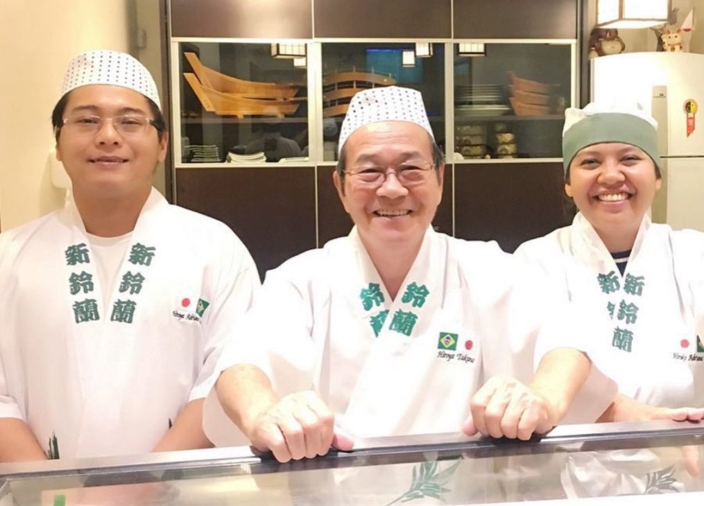 Takano and his children at their restaurant.