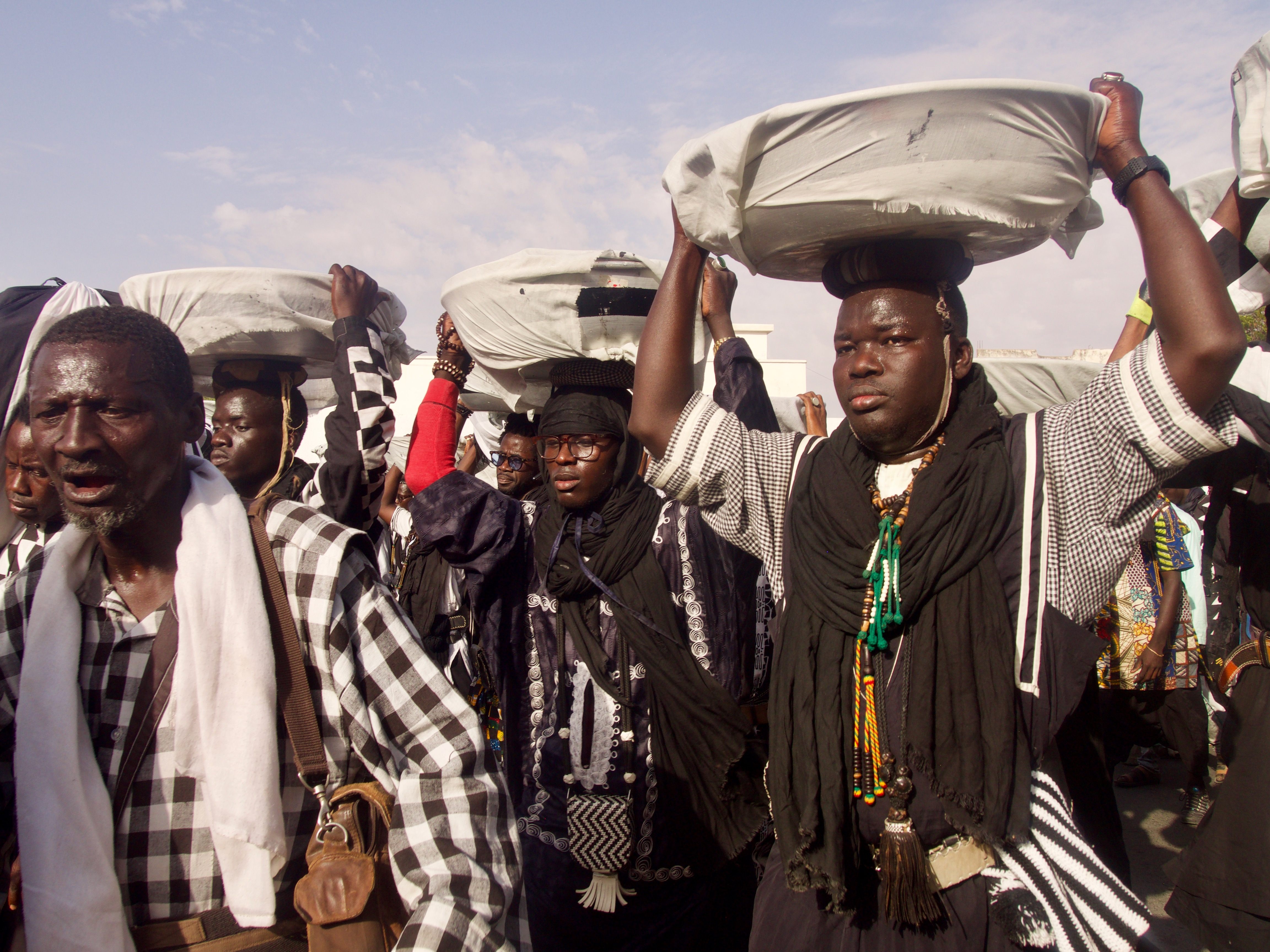 A special cadre of the Baye Fall carry the ngodou to the Grand Mosque.