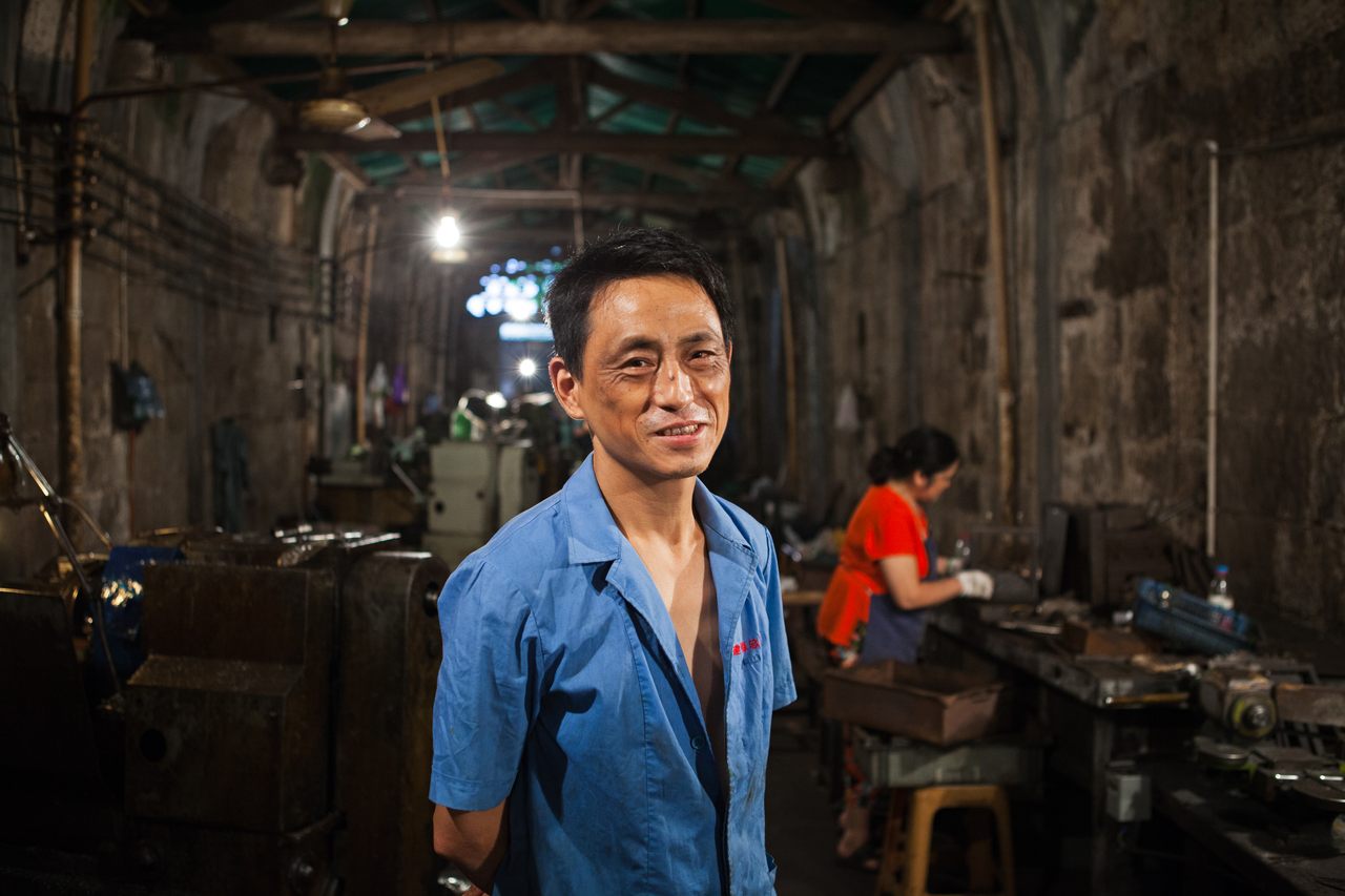 Tan, who works in a machine-parts factory in one of the tunnels under Chongqing.