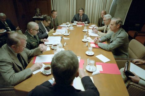 President Ronald Reagan with Caspar Weinberger, George Bush, Ed Meese, John Vessey, James Baker, Robert Mcfarlane, and George Shultz in a National Security Planning Group Meeting in The Situation Room, 10/23/1983