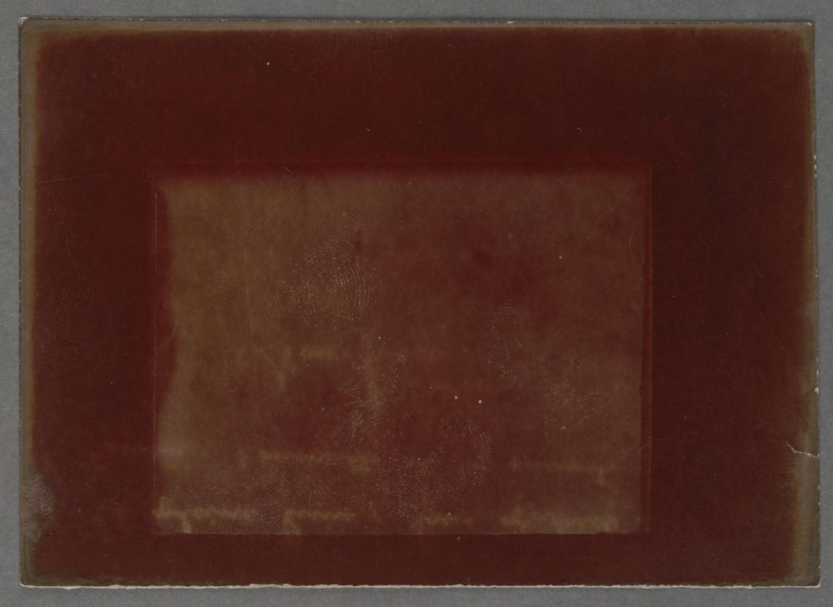 Some of the images bear fingerprints, such as this rust-red Rothko-esque exposure meant to depict the full moon.