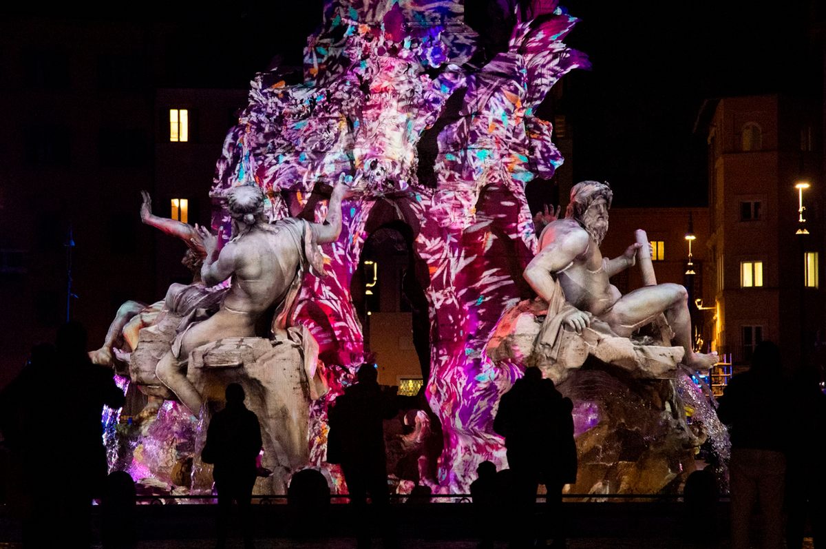 The Fountain of the Four Rivers (Fontana dei Quattro Fiumi) in Rome's Piazza Navona is decorated with a light-mapping display.