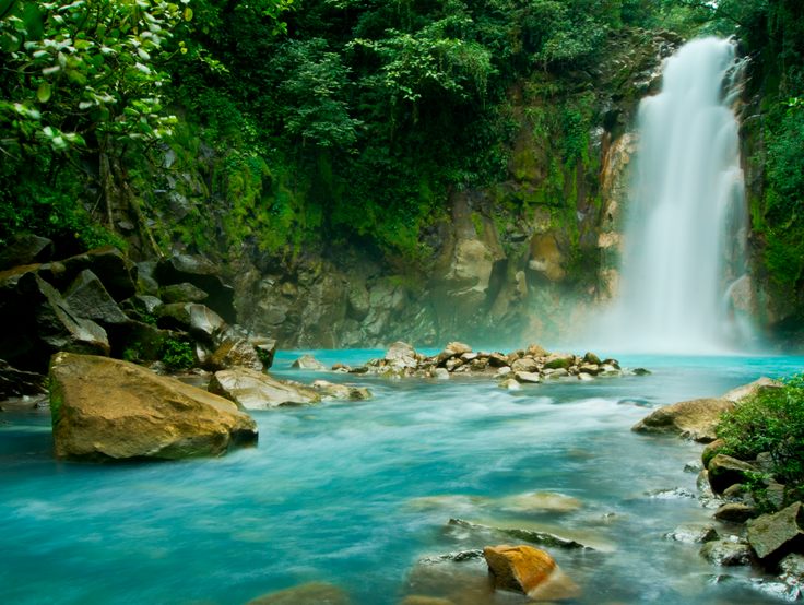 Rio Celeste waterfall with indigo blue water