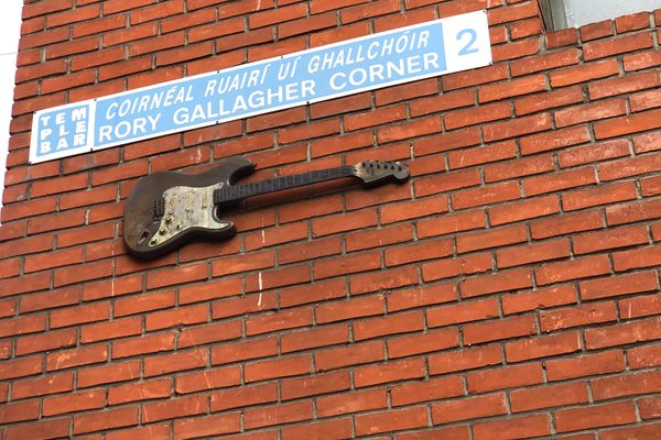 A guitar up on a wall. Rory Gallagher Corner